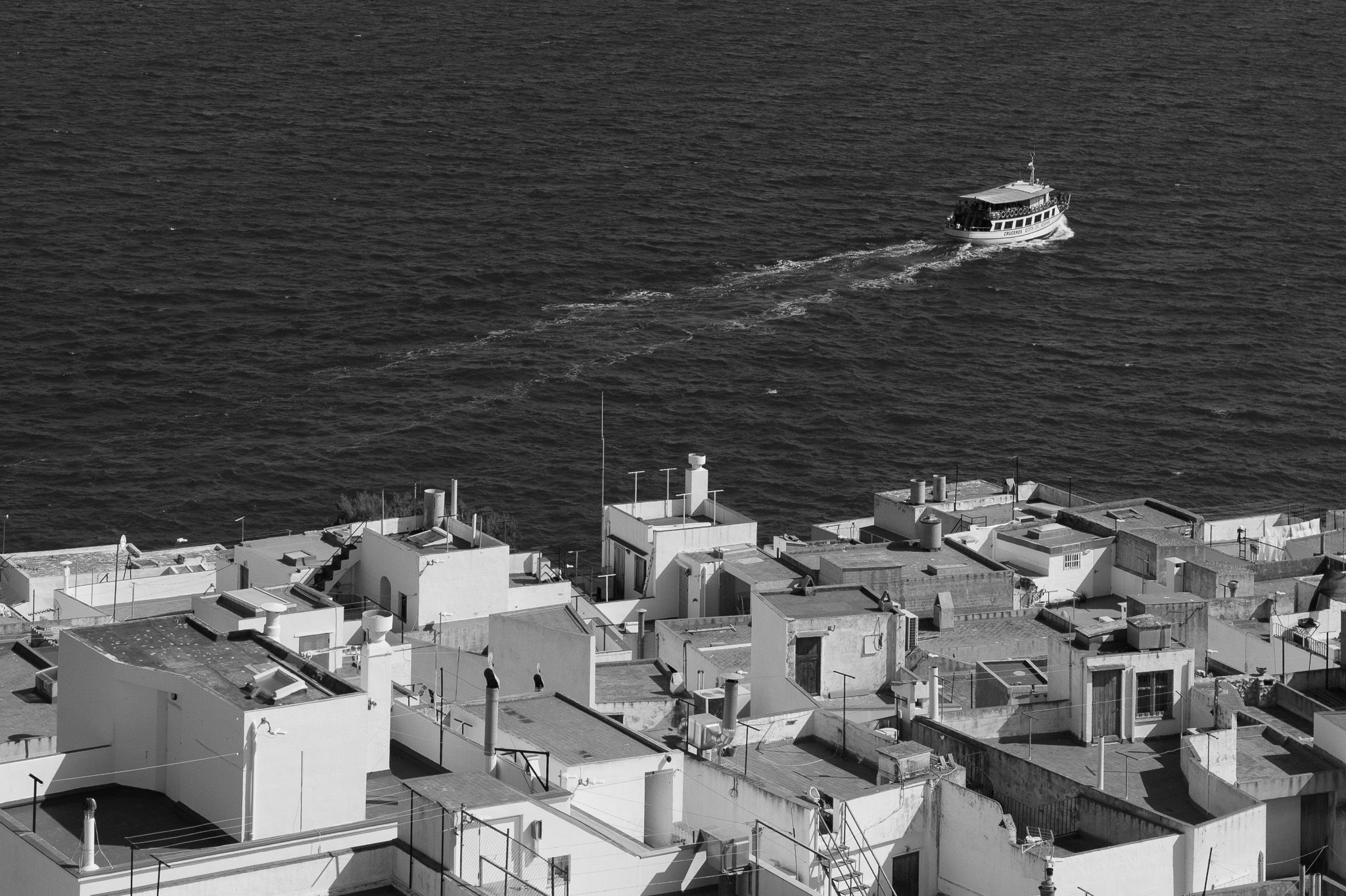 Panorama of the whitewashed rooftops of Peniscola with the Mediterranean Sea in the background